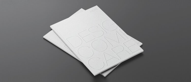 Two stacked brochures with the inscription Design Comfort Care