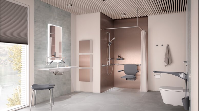 Salle de bain de soins sans barrière avec lavabo, espace douche et WC