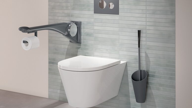 WC equipped with folding support handle and toilet brush in the color anthracite matt