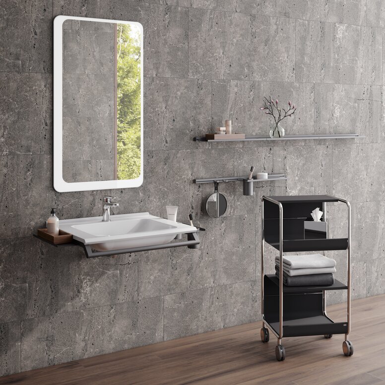 Modular washbasin with grab rail and shelves, side trolley next to it in matt black