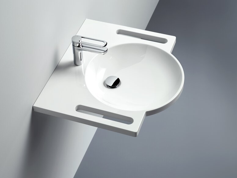 Washbasin with grab rail, round basin and single-lever tap in chrome